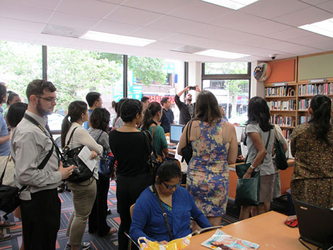 Photo of tour group standing in the library.