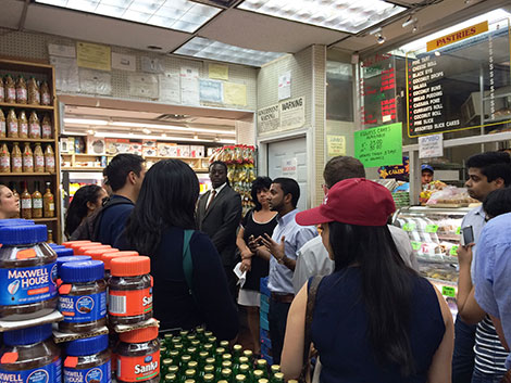 Photo of tour group standing in a supermarket.